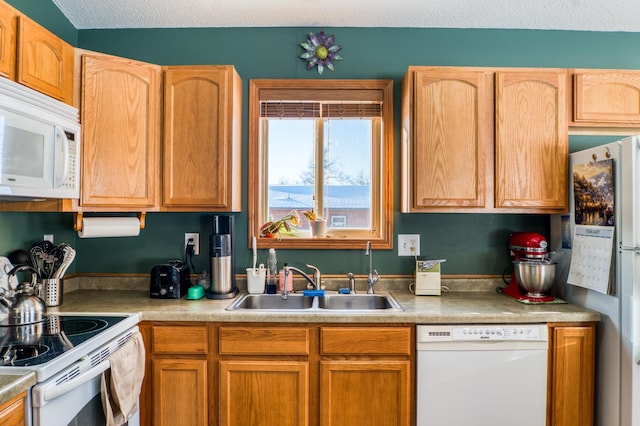 16693 Hightop Way NW, Cass Lake, MN 56633 - kitchen featuring white appliances, a sink, and light countertops