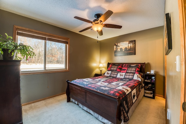 16693 Hightop Way NW, Cass Lake, MN 56633 - bedroom featuring carpet, a ceiling fan, baseboards, and a textured ceiling