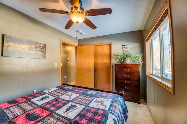 16693 Hightop Way NW, Cass Lake, MN 56633 - carpeted bedroom featuring baseboards, ceiling fan, and a textured ceiling
