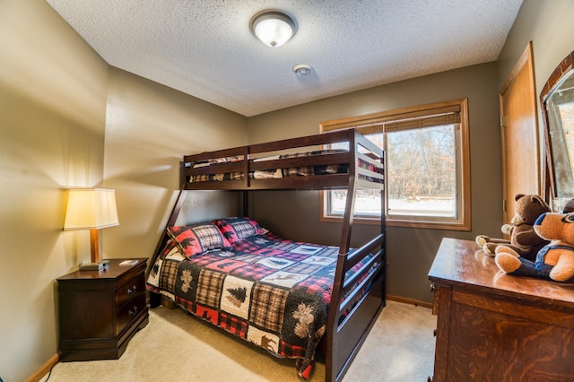 16693 Hightop Way NW, Cass Lake, MN 56633 - bedroom with light colored carpet, a textured ceiling, and baseboards