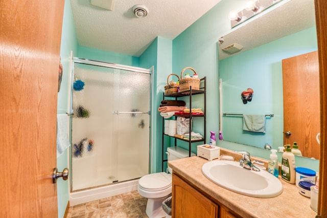 16693 Hightop Way NW, Cass Lake, MN 56633 - bathroom with a stall shower, toilet, vanity, and a textured ceiling