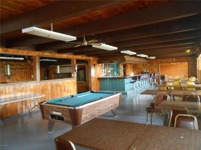 16693 Hightop Way NW, Cass Lake, MN 56633 - recreation room with wood walls, finished concrete floors, pool table, ceiling fan, and beamed ceiling