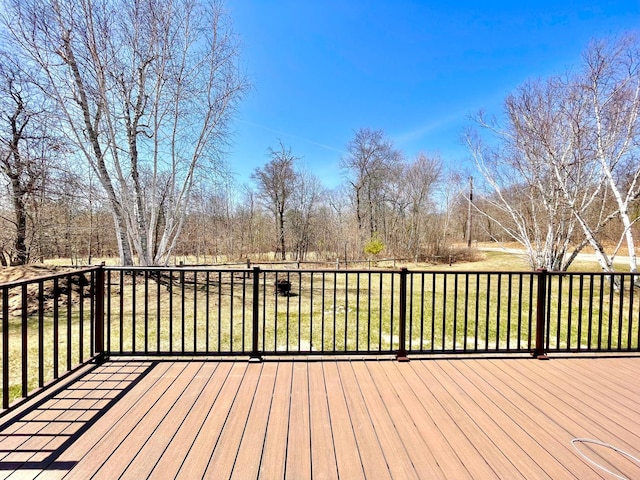 16693 Hightop Way NW, Cass Lake, MN 56633 - deck featuring a yard and view of wooded area