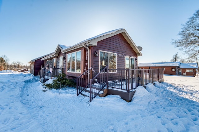 16693 Hightop Way NW, Cass Lake, MN 56633 - rustic home featuring a deck