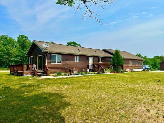 16693 Hightop Way NW, Cass Lake, MN 56633 - back of house featuring a yard and a deck