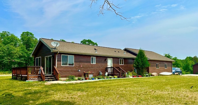 16693 Hightop Way NW, Cass Lake, MN 56633 - rear view of house featuring a lawn and a deck