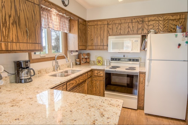 36 Ben Nevis Ln, Waite Park, MN 56387 - kitchen with a sink, brown cabinets, white appliances, and light stone counters
