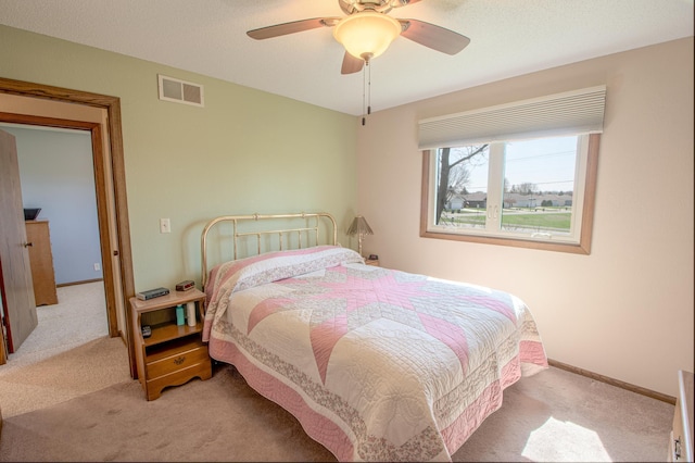36 Ben Nevis Ln, Waite Park, MN 56387 - carpeted bedroom featuring baseboards, ceiling fan, and visible vents