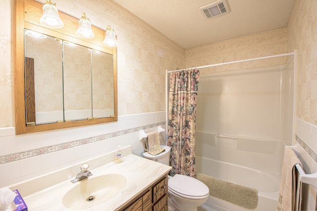 36 Ben Nevis Ln, Waite Park, MN 56387 - bathroom featuring vanity, toilet, tile walls, shower / tub combo, and visible vents