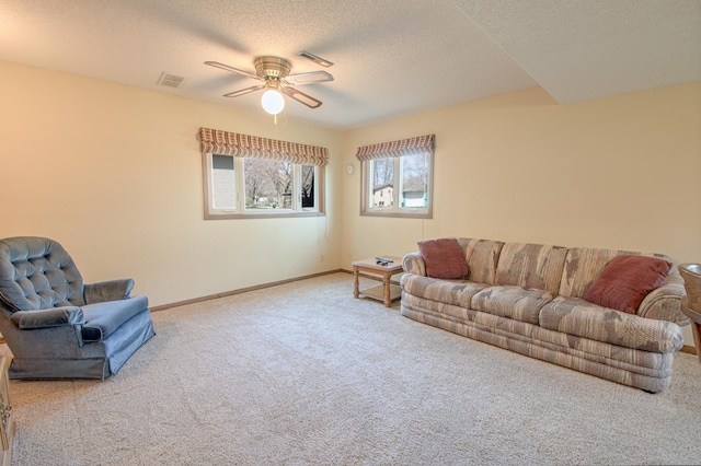 36 Ben Nevis Ln, Waite Park, MN 56387 - living room with ceiling fan, a textured ceiling, visible vents, carpet floors, and baseboards