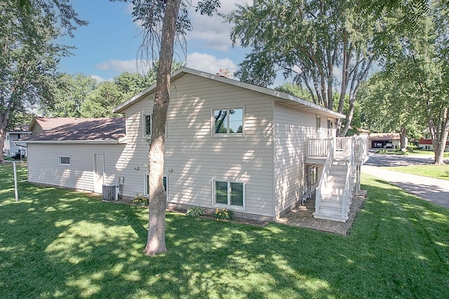 36 Ben Nevis Ln, Waite Park, MN 56387 - view of home's exterior featuring a yard, stairs, and a deck