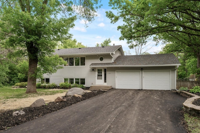 21485 Inwood Ave N, Forest Lake, MN 55025 - view of front of home with asphalt driveway, an attached garage, and roof with shingles