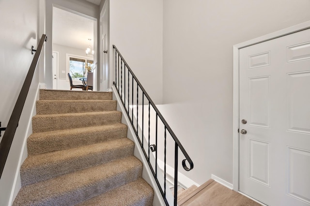 21485 Inwood Ave N, Forest Lake, MN 55025 - stairs featuring a chandelier