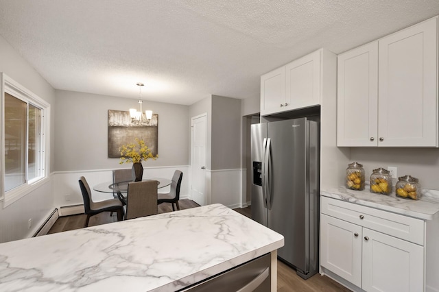21485 Inwood Ave N, Forest Lake, MN 55025 - kitchen with stainless steel refrigerator with ice dispenser, dark wood finished floors, baseboard heating, a textured ceiling, and white cabinets