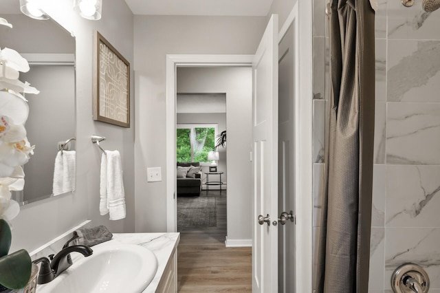 21485 Inwood Ave N, Forest Lake, MN 55025 - full bathroom featuring curtained shower, wood finished floors, and vanity