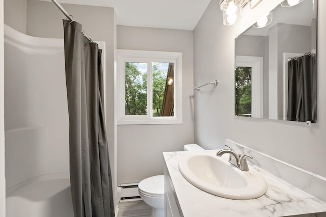 21485 Inwood Ave N, Forest Lake, MN 55025 - full bathroom with vanity, toilet, a shower with curtain, and a baseboard heating unit