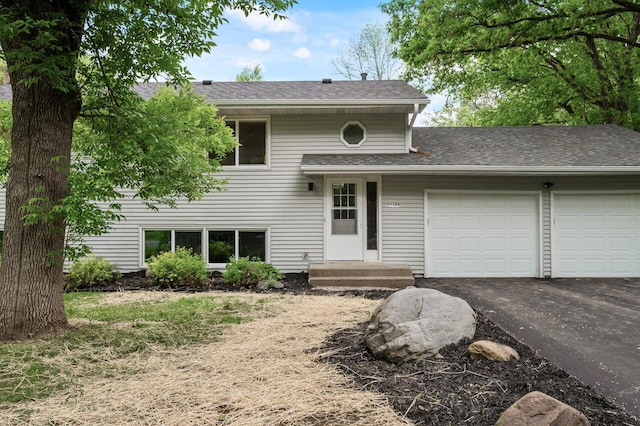 21485 Inwood Ave N, Forest Lake, MN 55025 - view of front of property with a garage, driveway, and a shingled roof