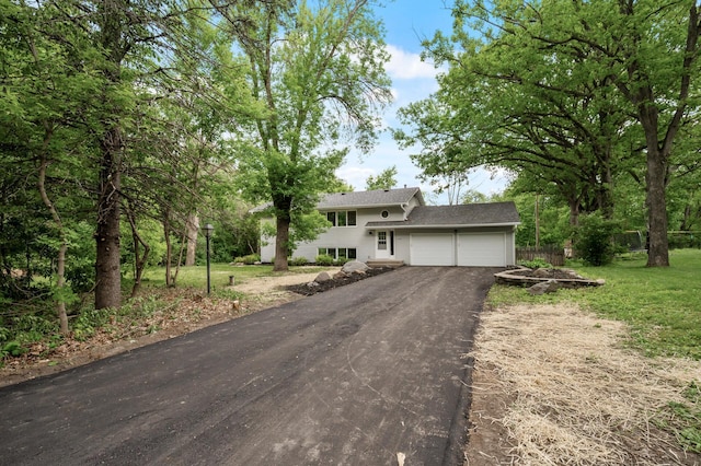 21485 Inwood Ave N, Forest Lake, MN 55025 - tri-level home featuring asphalt driveway and an attached garage