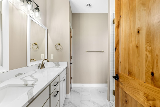 25882 Emerson Ct, Wyoming, MN 55092 - bathroom with double vanity, a sink, visible vents, baseboards, and marble finish floor