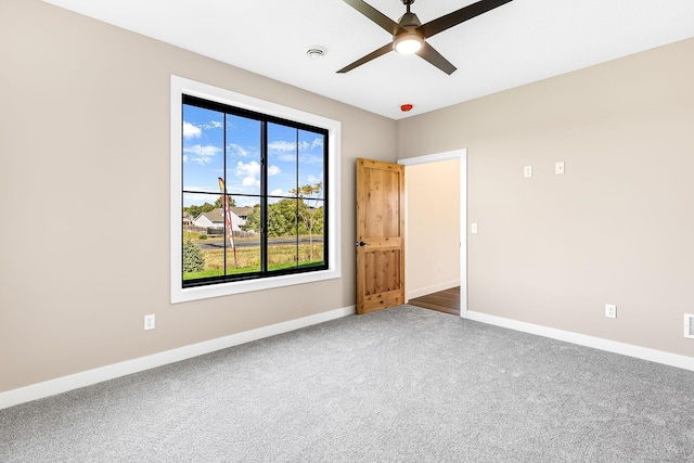25882 Emerson Ct, Wyoming, MN 55092 - unfurnished room with baseboards, ceiling fan, and carpet floors