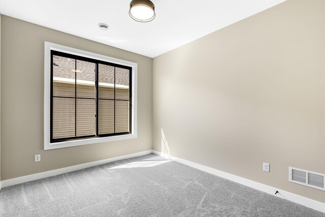 25882 Emerson Ct, Wyoming, MN 55092 - carpeted empty room featuring baseboards and visible vents