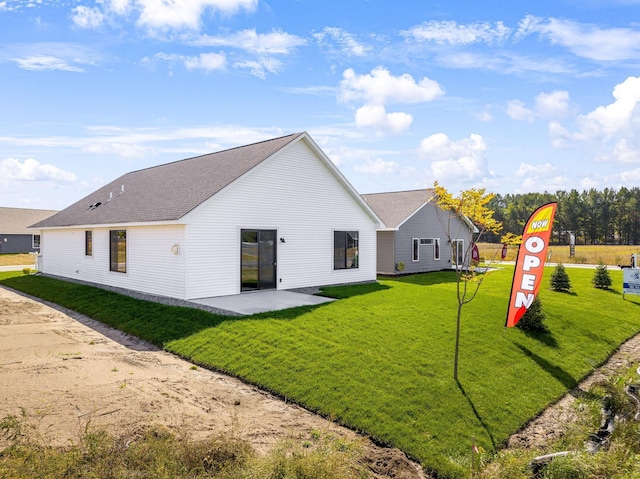 25882 Emerson Ct, Wyoming, MN 55092 - back of house featuring a yard, a patio area, and a shingled roof