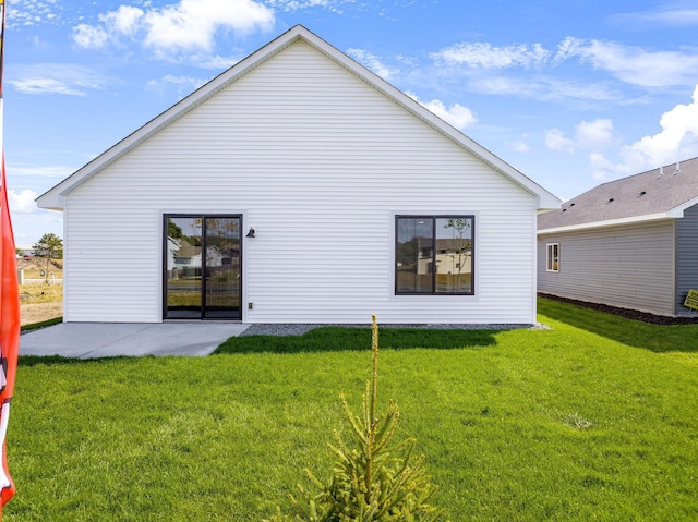25882 Emerson Ct, Wyoming, MN 55092 - rear view of house with a yard and a patio area