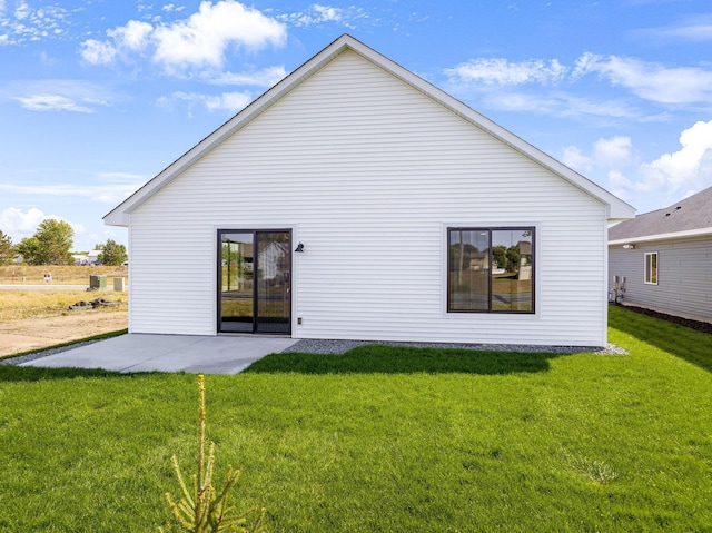 25882 Emerson Ct, Wyoming, MN 55092 - back of house featuring a yard and a patio area