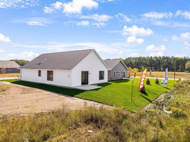 25882 Emerson Ct, Wyoming, MN 55092 - back of property featuring a yard and a patio area