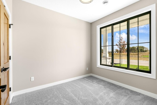 25882 Emerson Ct, Wyoming, MN 55092 - spare room with baseboards and carpet floors