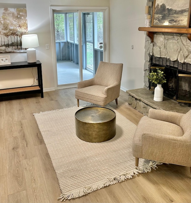 809 Wagon Wheel Trl, Mendota Heights, MN 55120 - living area with baseboards, wood finished floors, and a fireplace