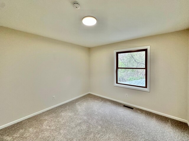 809 Wagon Wheel Trl, Mendota Heights, MN 55120 - empty room featuring carpet floors, baseboards, and visible vents