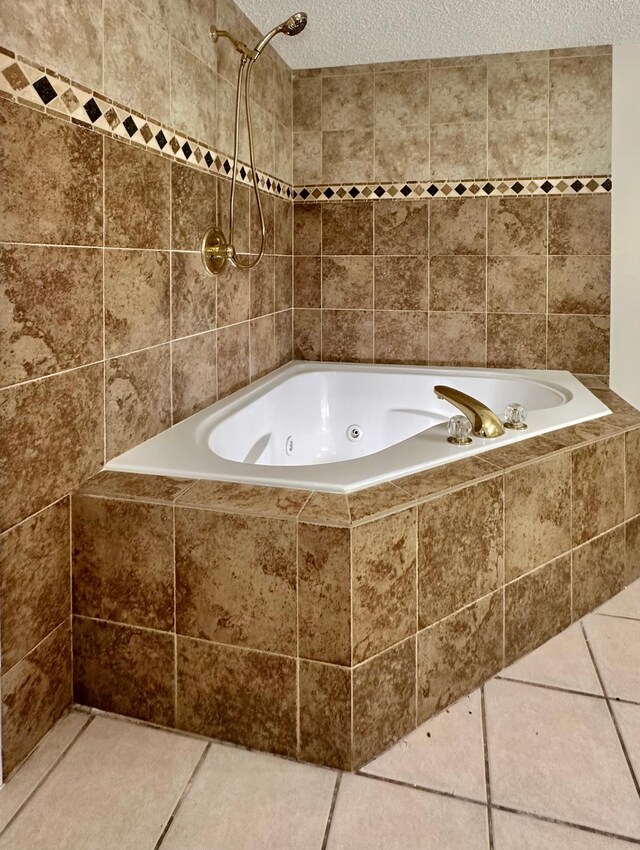 809 Wagon Wheel Trl, Mendota Heights, MN 55120 - bathroom featuring a tub with jets, a textured ceiling, tile patterned floors, and a tile shower