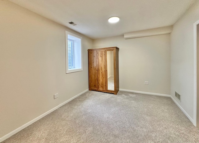 809 Wagon Wheel Trl, Mendota Heights, MN 55120 - unfurnished bedroom with baseboards, light carpet, and visible vents