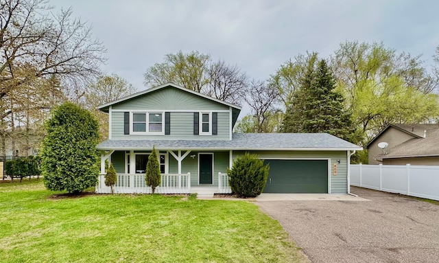 809 Wagon Wheel Trl, Mendota Heights, MN 55120 - traditional-style home with covered porch, driveway, fence, a front lawn, and an attached garage