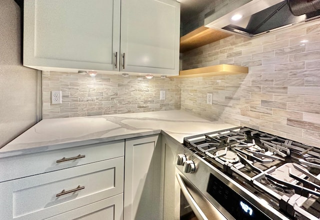 809 Wagon Wheel Trl, Mendota Heights, MN 55120 - kitchen with light stone countertops, open shelves, stainless steel range with gas stovetop, range hood, and tasteful backsplash