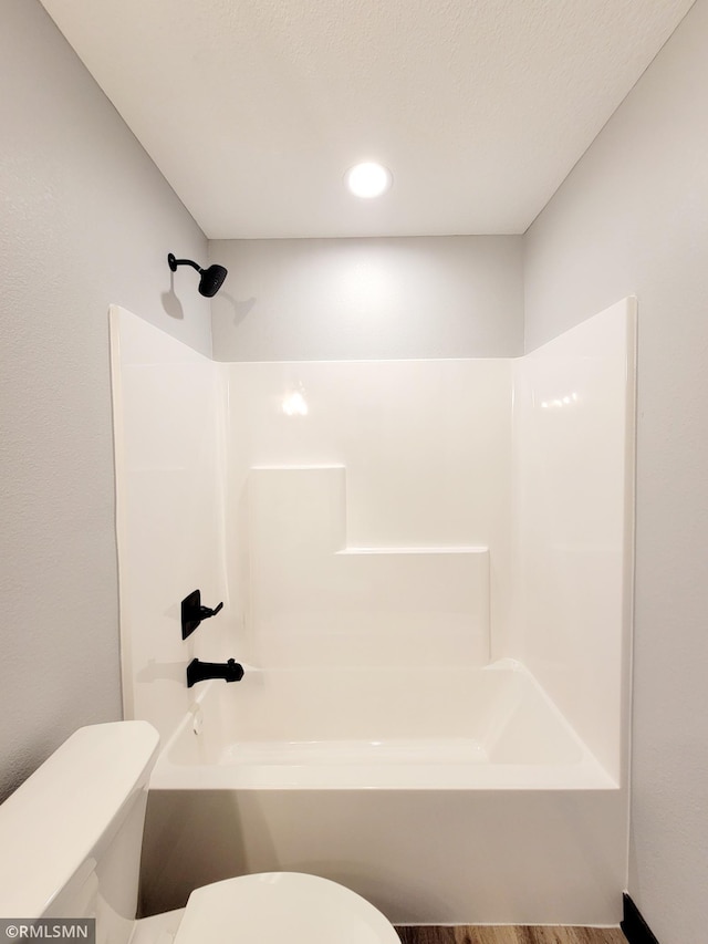 full bath with toilet, shower / bath combination, and recessed lighting