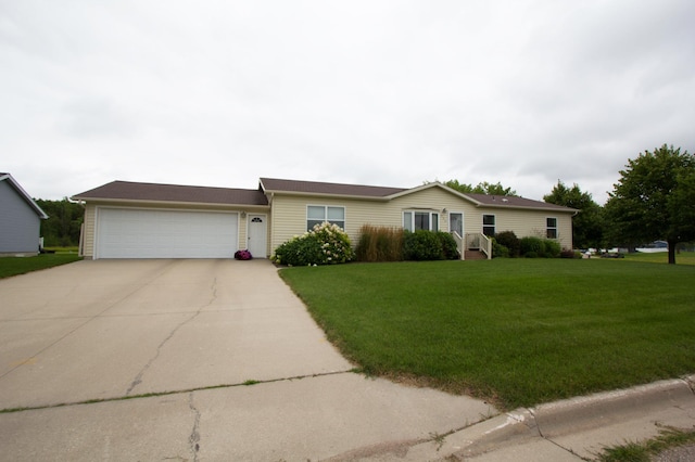932 Spruce Ave S, Thief River Falls, MN 56701 - ranch-style house with a garage, concrete driveway, and a front lawn