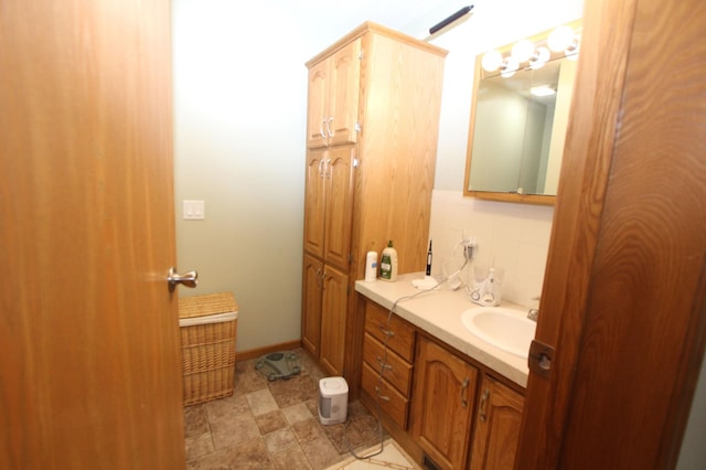 932 Spruce Ave S, Thief River Falls, MN 56701 - bathroom featuring vanity and backsplash
