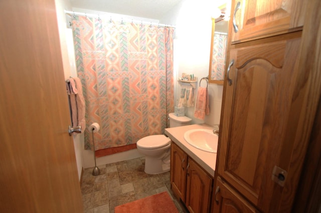 932 Spruce Ave S, Thief River Falls, MN 56701 - full bathroom with vanity, stone finish flooring, and toilet