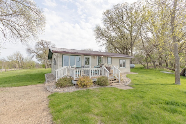 43 Blue Stem Rd, Shetek Twp, MN 56175 - view of front facade featuring a deck, a front lawn, and metal roof