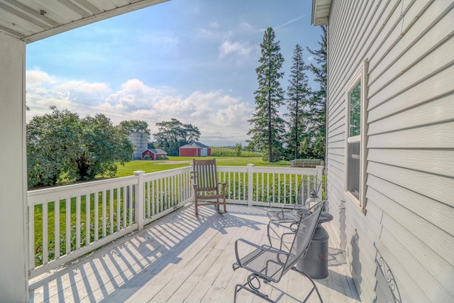 wooden deck featuring a yard