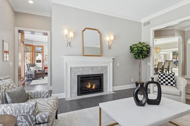 2454 Crowne Hill Rd, Minnetonka, MN 55305 - living room featuring crown molding, a premium fireplace, baseboards, visible vents, and dark wood-style floors