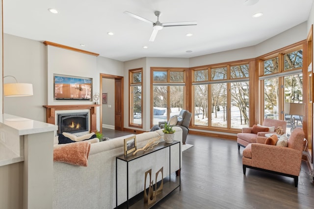 2454 Crowne Hill Rd, Minnetonka, MN 55305 - living area featuring recessed lighting, dark wood-type flooring, ceiling fan, and a warm lit fireplace