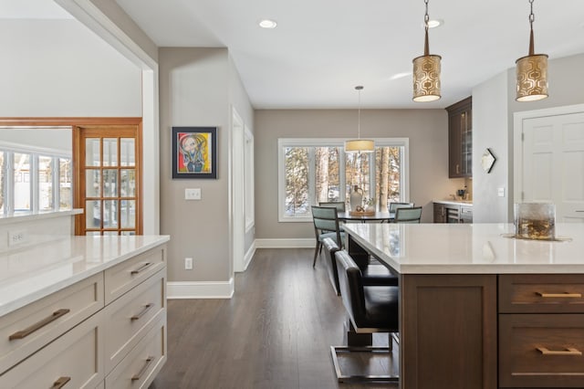 2454 Crowne Hill Rd, Minnetonka, MN 55305 - kitchen with glass insert cabinets, baseboards, recessed lighting, and dark wood-style flooring