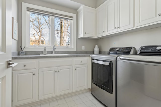 2454 Crowne Hill Rd, Minnetonka, MN 55305 - washroom featuring a sink, washer and clothes dryer, cabinet space, and light tile patterned flooring