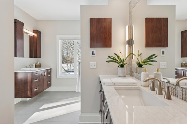2454 Crowne Hill Rd, Minnetonka, MN 55305 - full bathroom with tile patterned flooring, a sink, baseboards, and two vanities