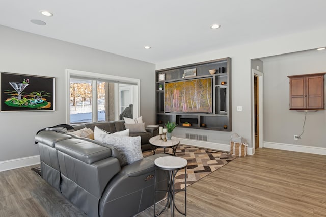 2454 Crowne Hill Rd, Minnetonka, MN 55305 - living room with baseboards, recessed lighting, wood finished floors, and visible vents