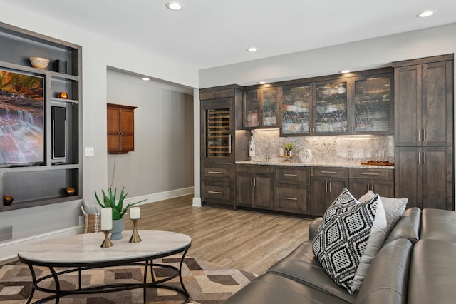 2454 Crowne Hill Rd, Minnetonka, MN 55305 - bar featuring bar, decorative backsplash, visible vents, light wood-style floors, and recessed lighting