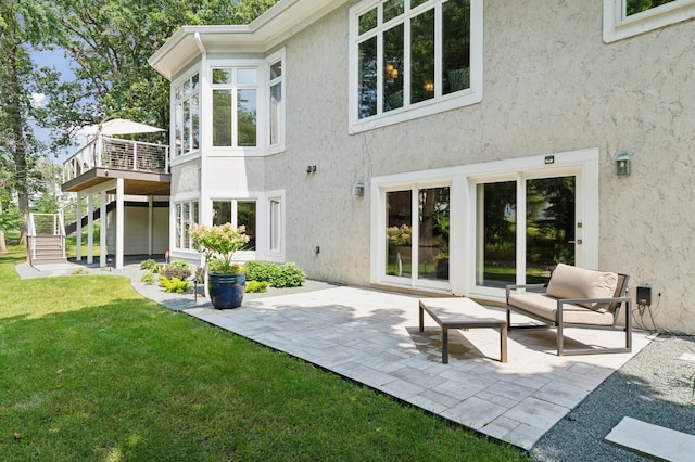 2454 Crowne Hill Rd, Minnetonka, MN 55305 - back of house featuring a wooden deck, stucco siding, stairway, a patio, and a yard
